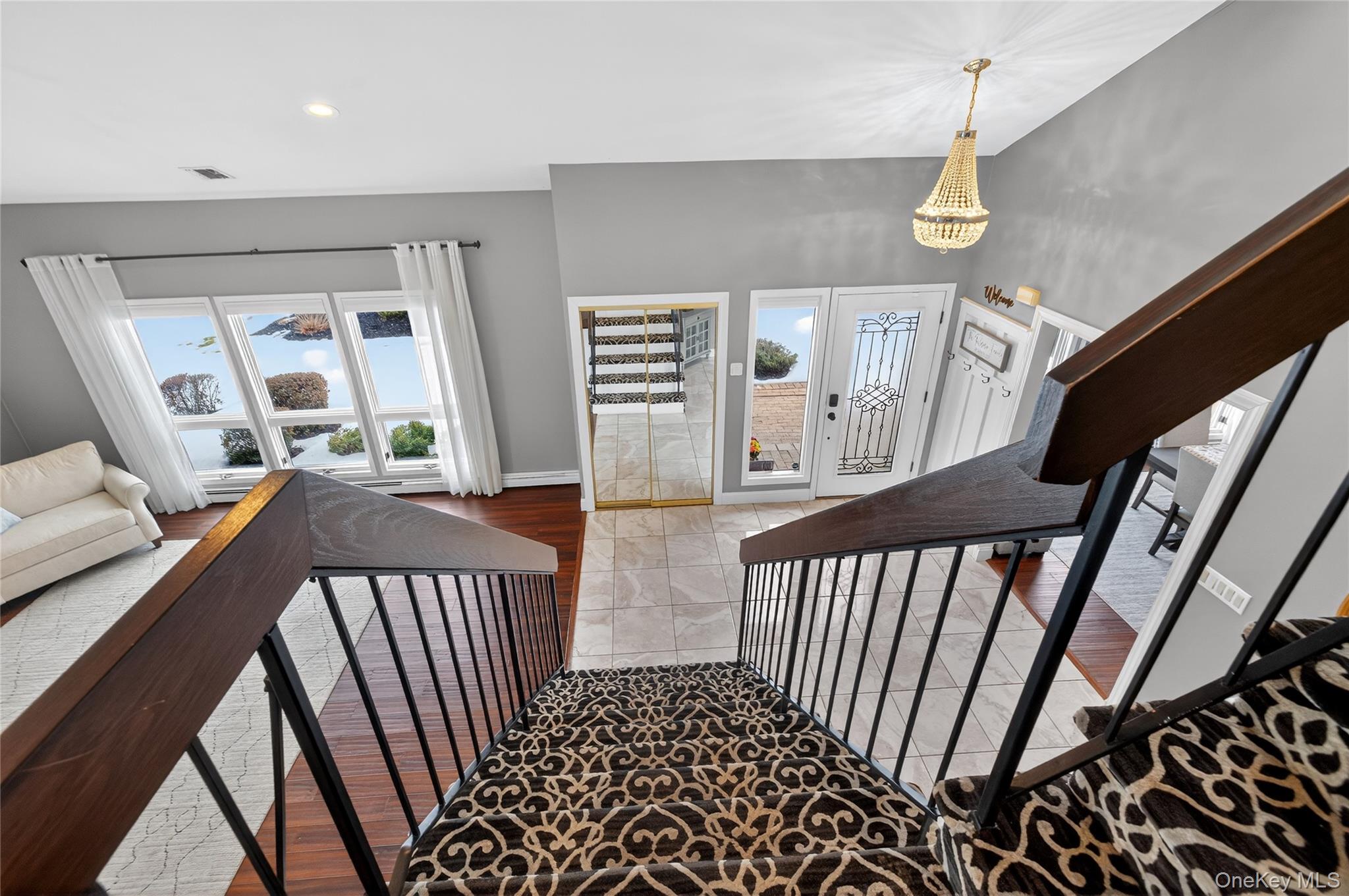 53 Timber Ridge Drive Commack, NY 11725 - Photo 29 of 50 a view of a porch with furniture and hardwood floor