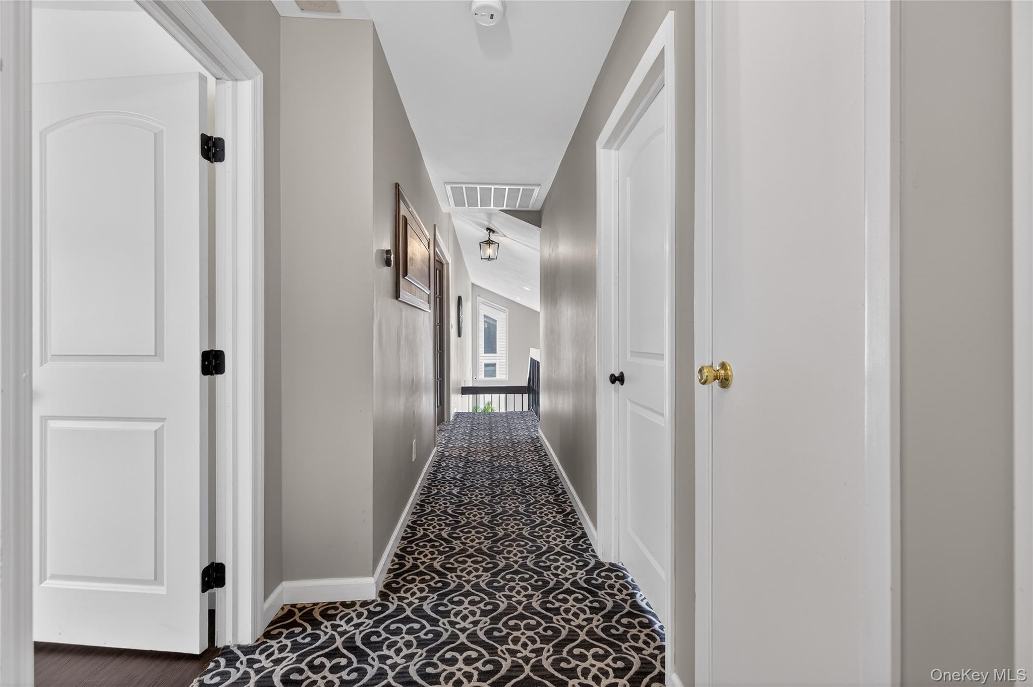 53 Timber Ridge Drive Commack, NY 11725 - Photo 30 of 50 a view of a hallway with wooden floor and staircase
