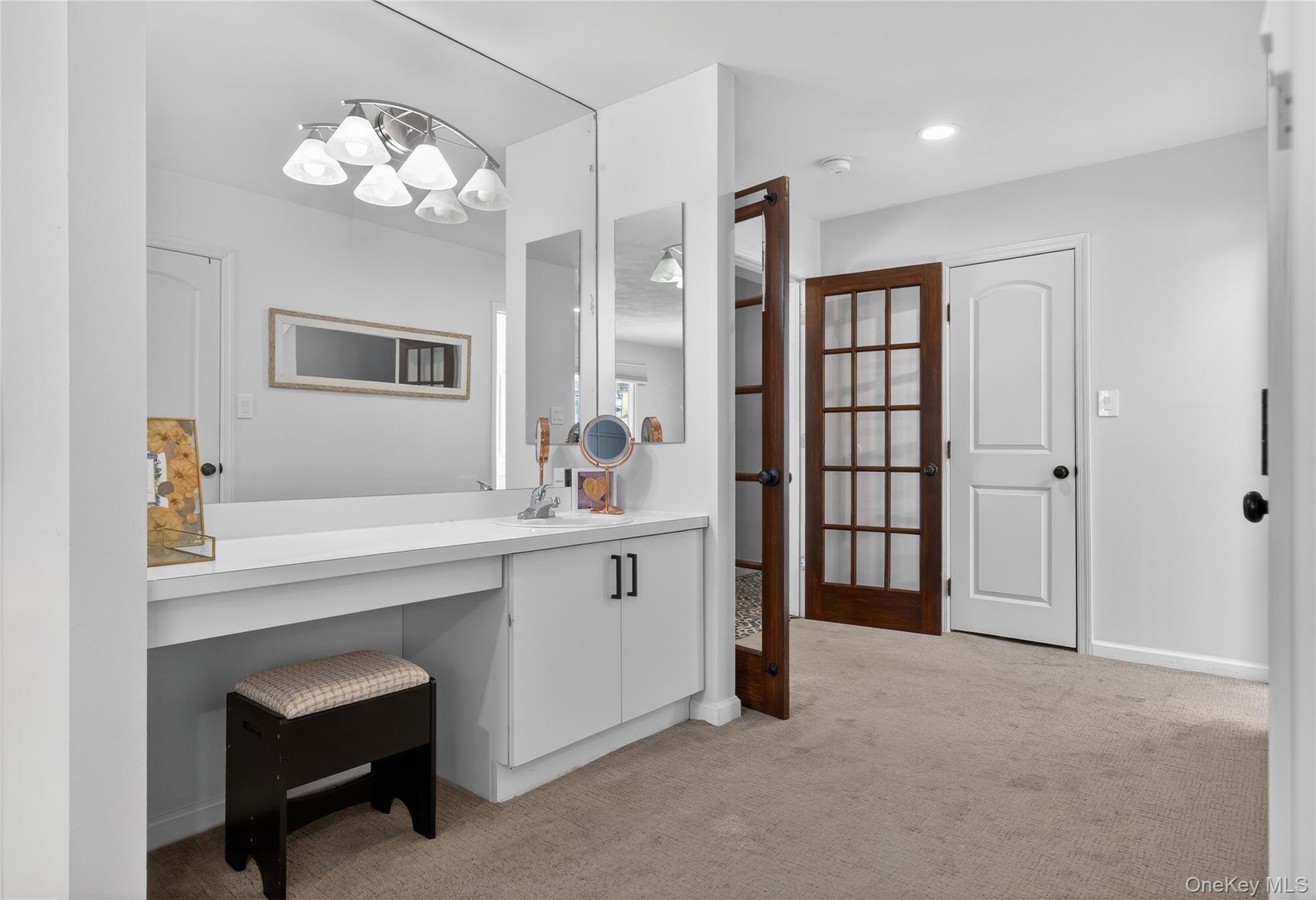 53 Timber Ridge Drive Commack, NY 11725 - Photo 34 of 50 a spacious bathroom with a sink double vanity and a mirror