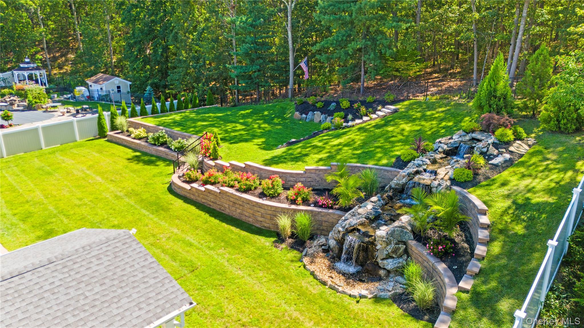 53 Timber Ridge Drive Commack, NY 11725 - Photo 43 of 50 a view of a swimming pool with a garden