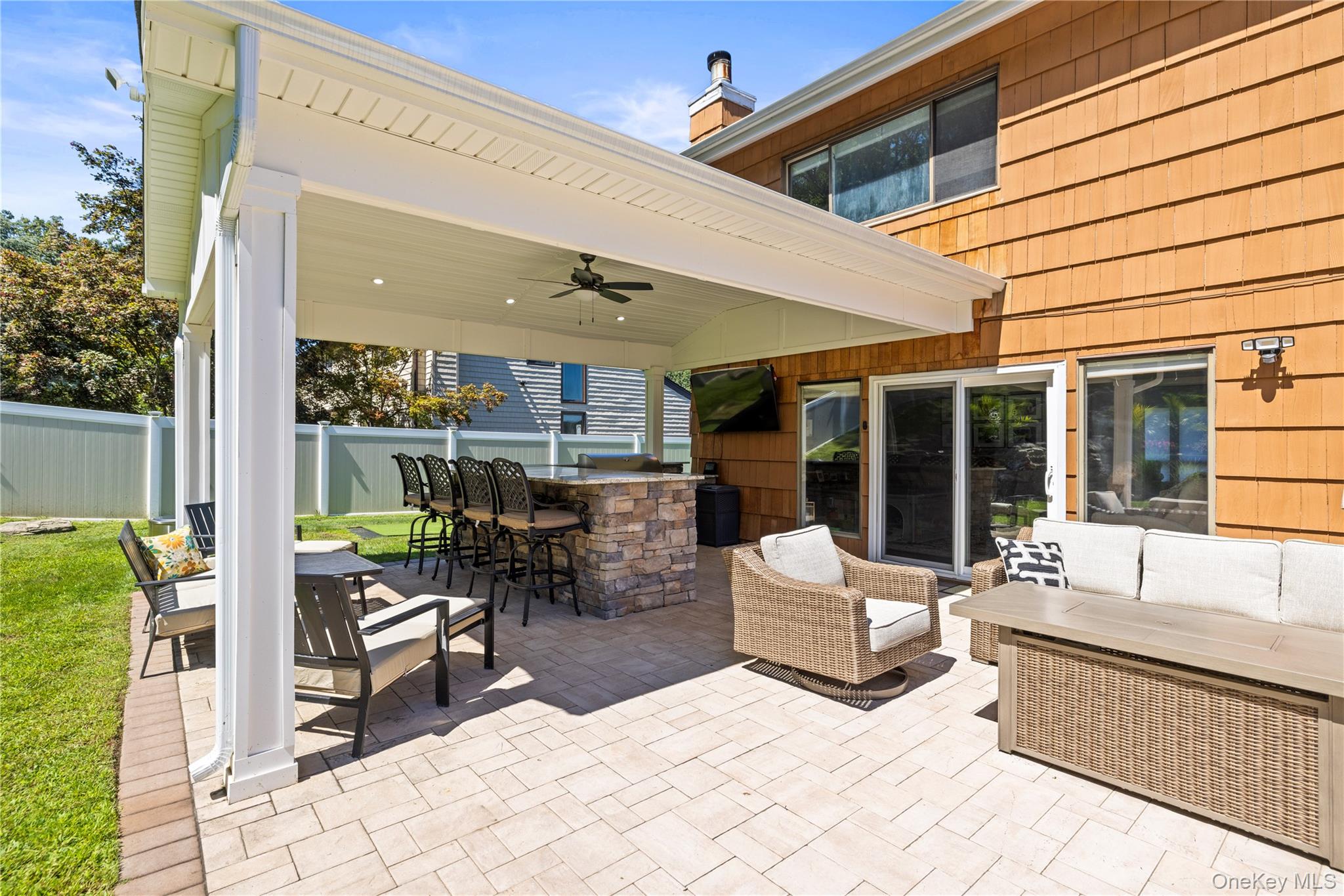53 Timber Ridge Drive Commack, NY 11725 - Photo 44 of 50 a building outdoor space with patio furniture and potted plants