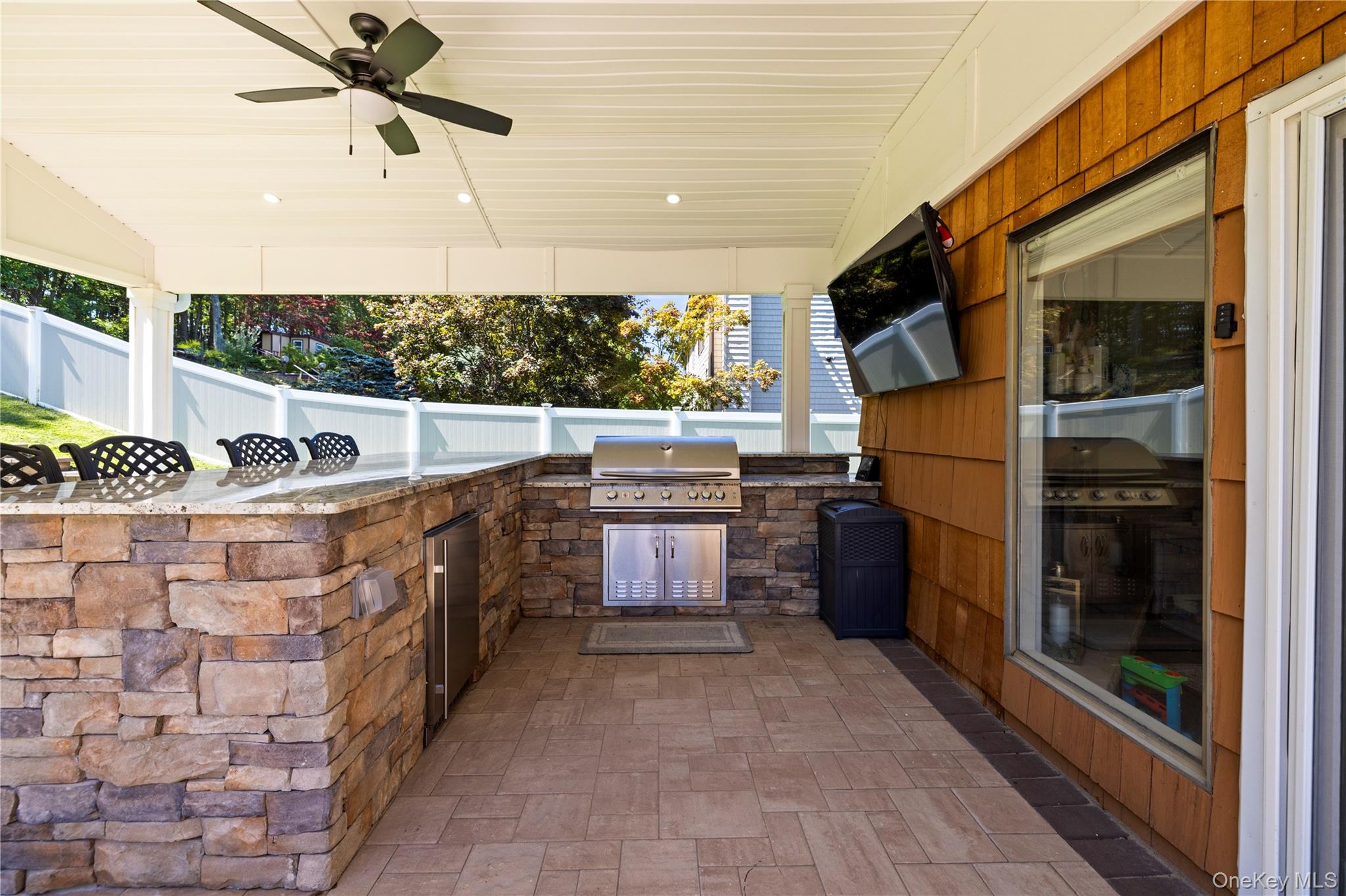 53 Timber Ridge Drive Commack, NY 11725 - Photo 45 of 50 a kitchen with stainless steel appliances granite countertop a stove a sink and a refrigerator