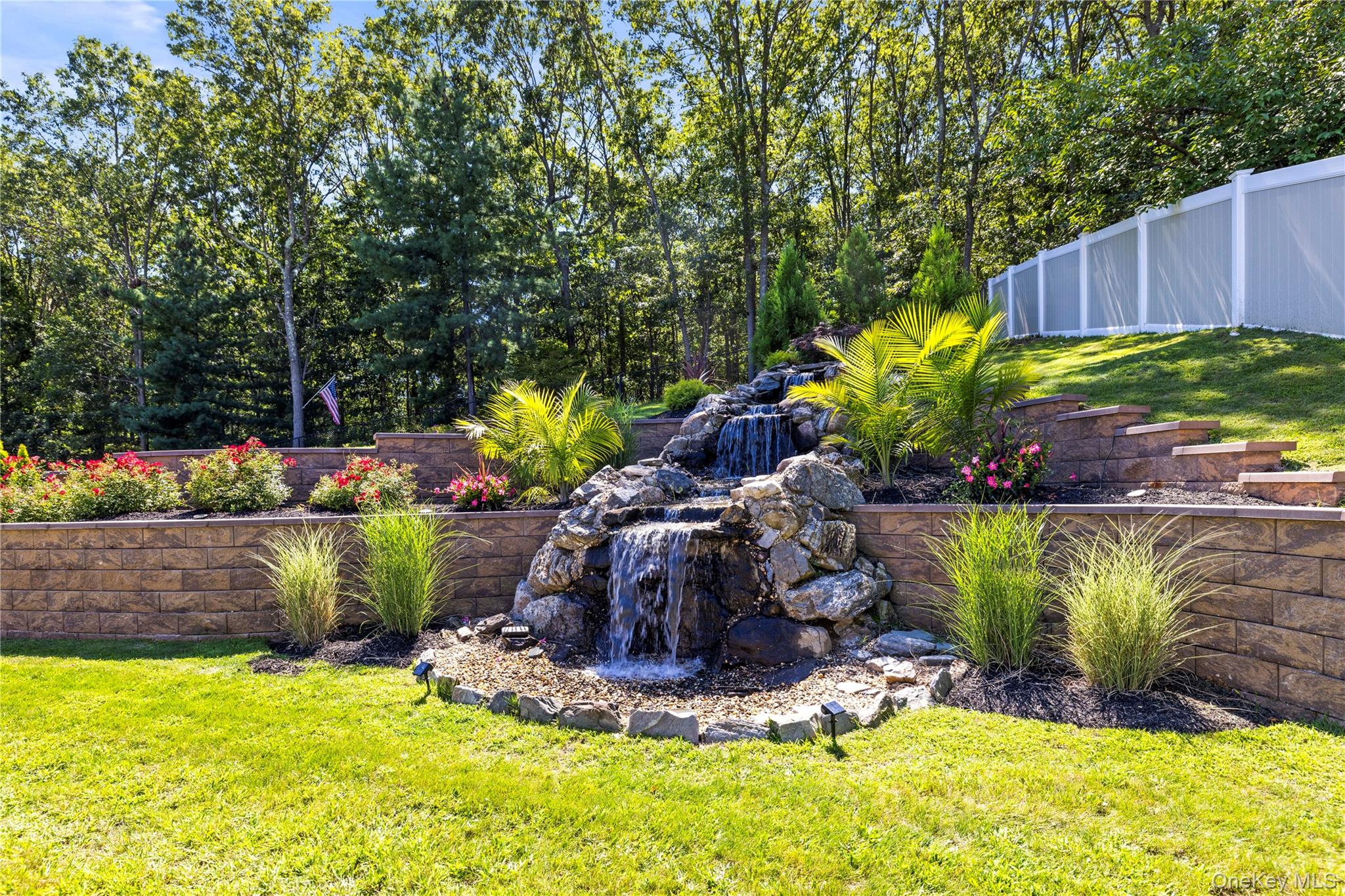 53 Timber Ridge Drive Commack, NY 11725 - Photo 48 of 50 a building with trees in the background