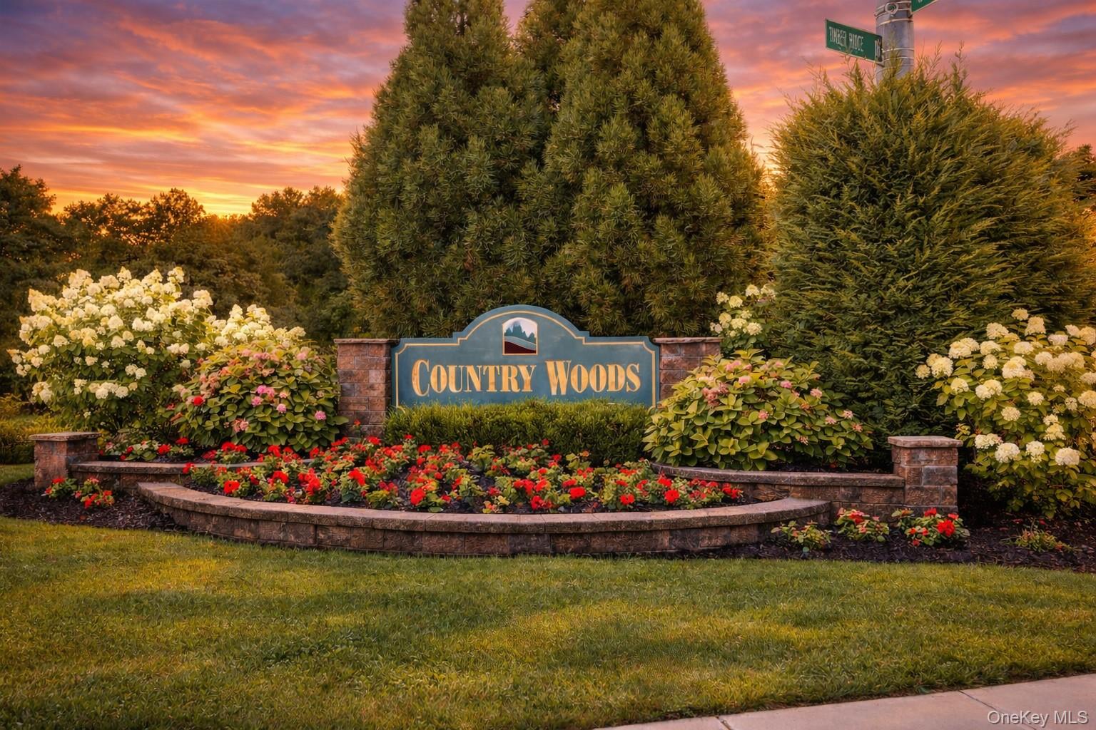 53 Timber Ridge Drive Commack, NY 11725 - Photo 50 of 50 a front view of a house with a garden and swimming pool