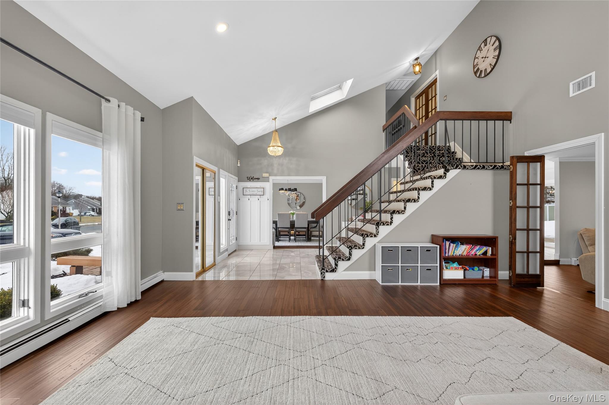 53 Timber Ridge Drive Commack, NY 11725 - Photo 9 of 50 a view of entryway and hall with wooden floor