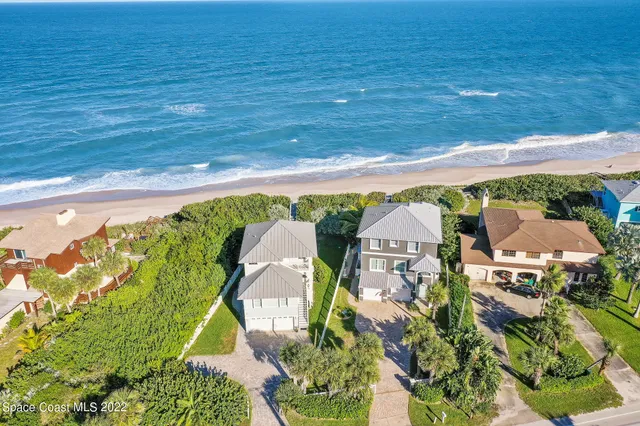 an aerial view of a house with a garden