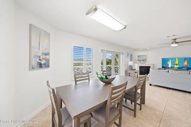 a view of a dining room with furniture and window