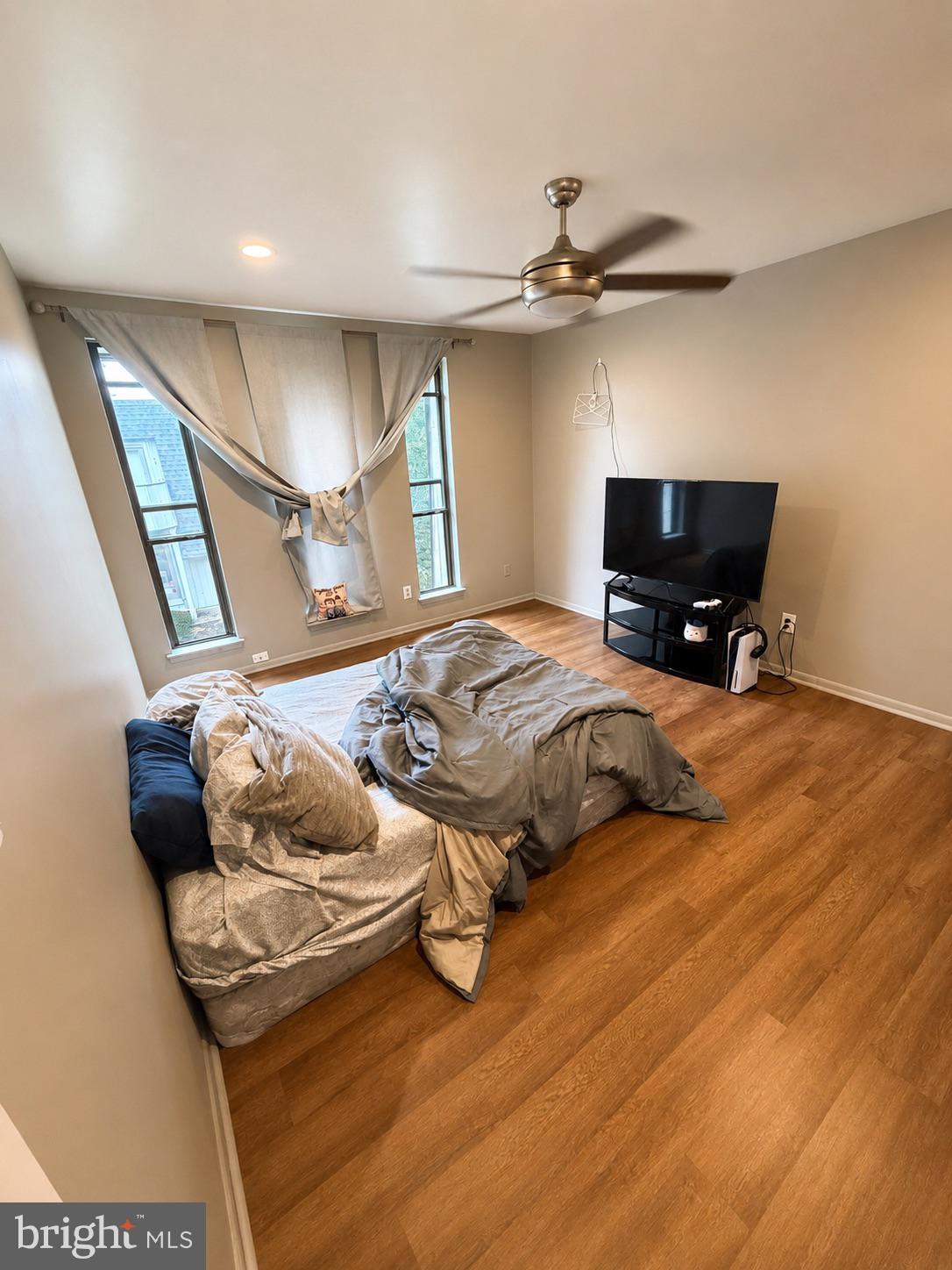 25 South Church Road, Unit 52 Maple Shade, NJ 08052 - Photo 9 of 10 a bedroom with a bed and wooden floor