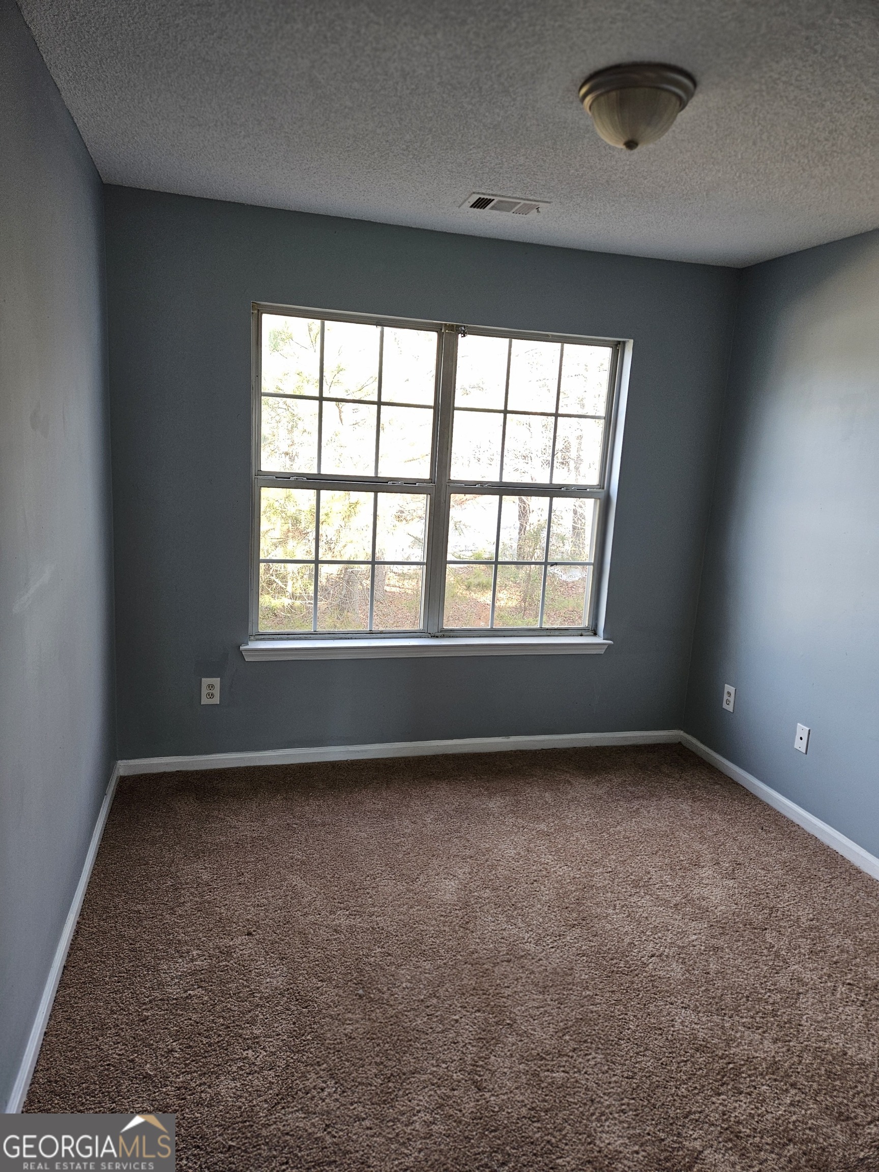 1467 Riverrock Trail Southwest Riverdale, GA 30296 - Photo 5 of 8 an empty room with a window