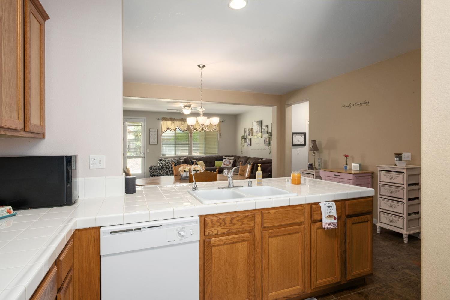 454 Sierra Avenue Reedley, CA 93654 - Photo 15 of 25 a kitchen with a sink appliances and cabinets