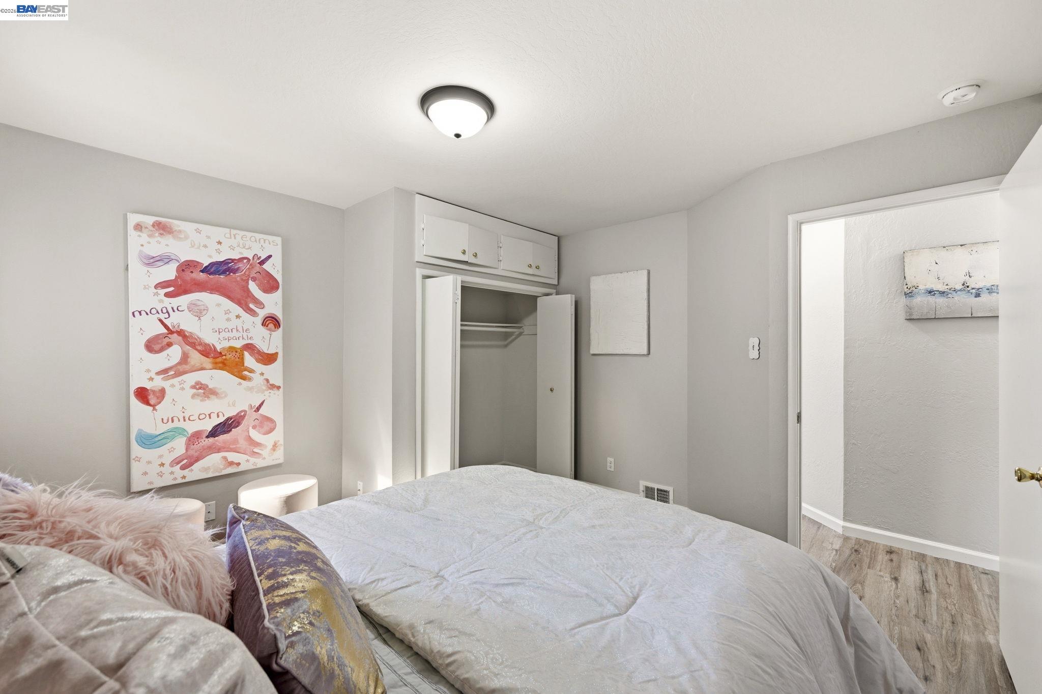 4352 Davis Way Livermore, CA 94550 - Photo 23 of 37 a bedroom with a bed and painting on the wall