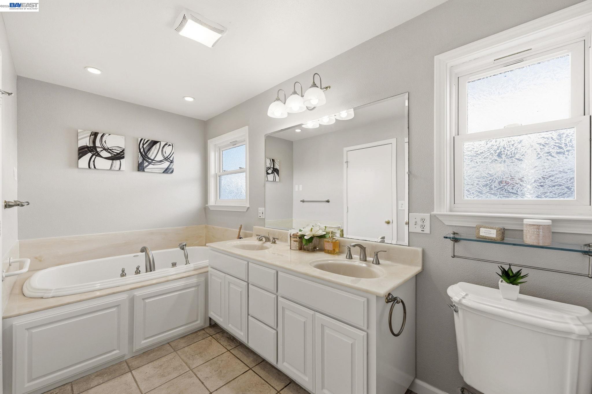 4352 Davis Way Livermore, CA 94550 - Photo 26 of 37 a view of bathroom with a sink mirror and toilet