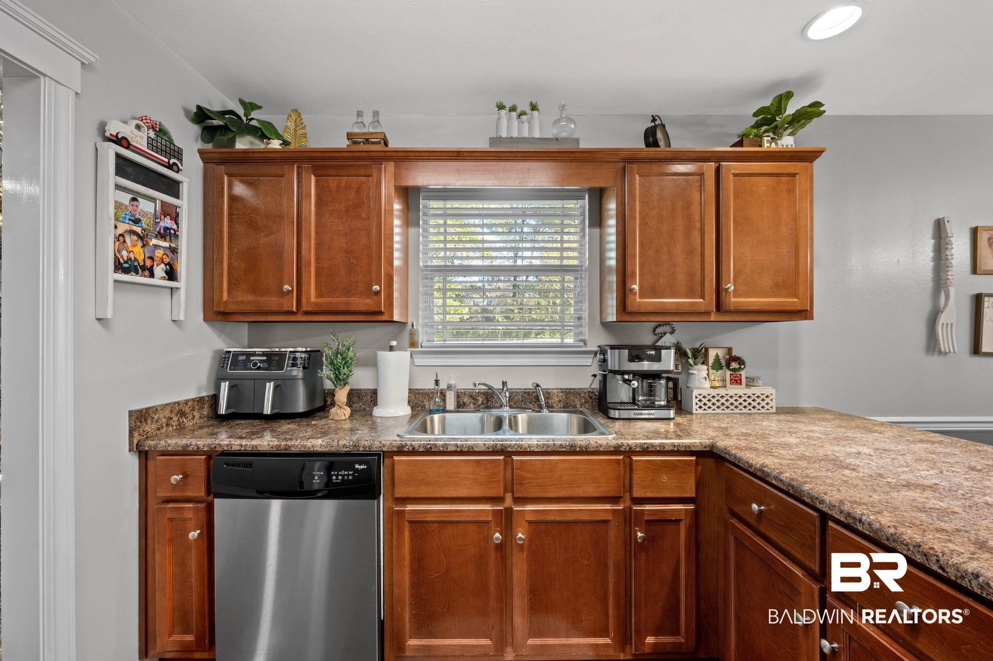 9366 Fox Run Court Semmes, AL 36575 - Photo 13 of 29 Kitchen featuring light stone counters, sink, and stainless steel dishwasher