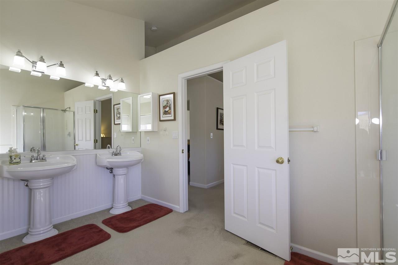 105 John Thomas Lane Reno, NV 89508 - Photo 16 of 25 a bathroom with a sink and a mirror