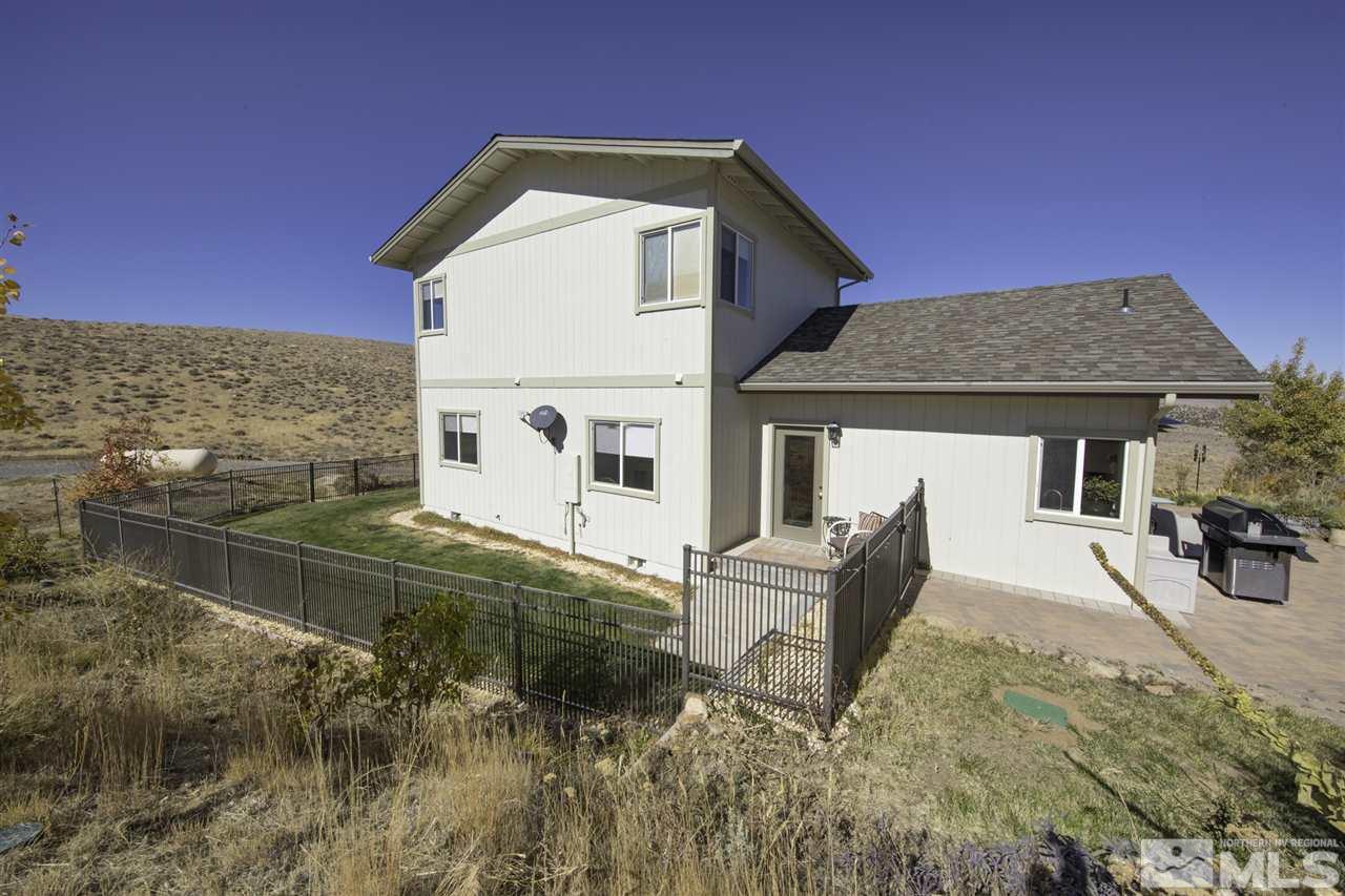 105 John Thomas Lane Reno, NV 89508 - Photo 20 of 25 a front view of a house with garden