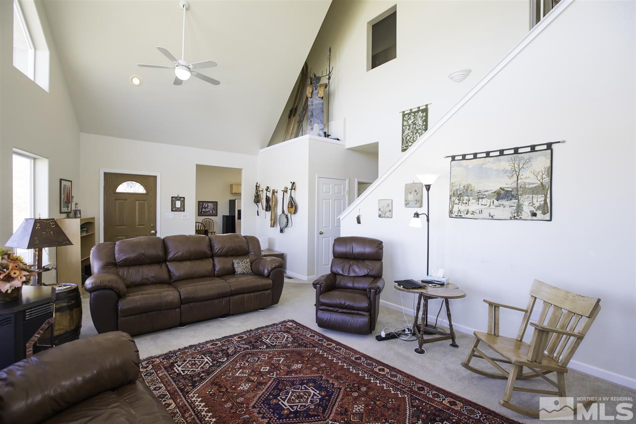 105 John Thomas Lane Reno, NV 89508 - Photo 5 of 25 a living room with furniture and a rug