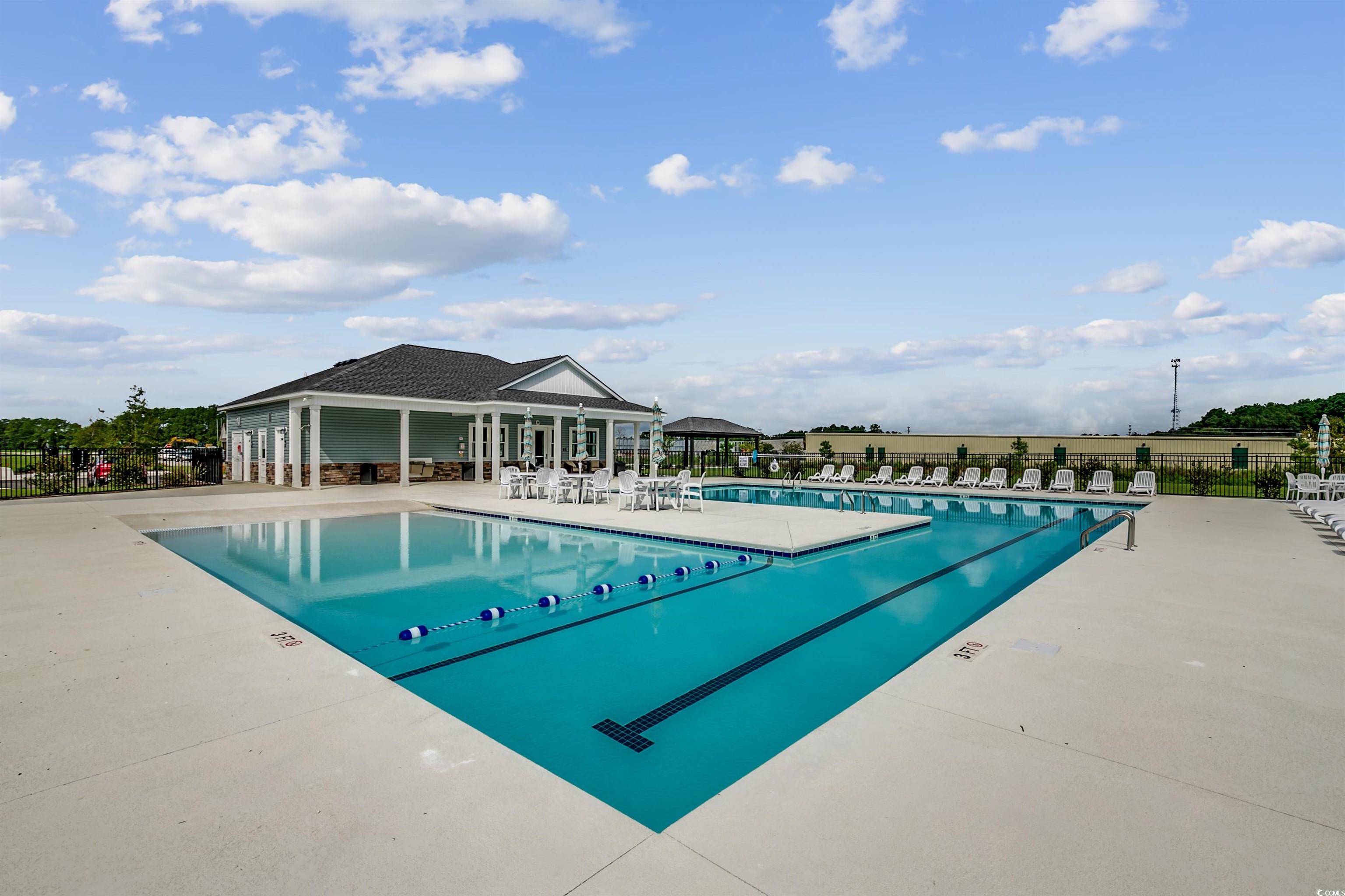 353 Kapalua Loop Little River, SC 29566 - Photo 10 of 11 Community pool with a patio area