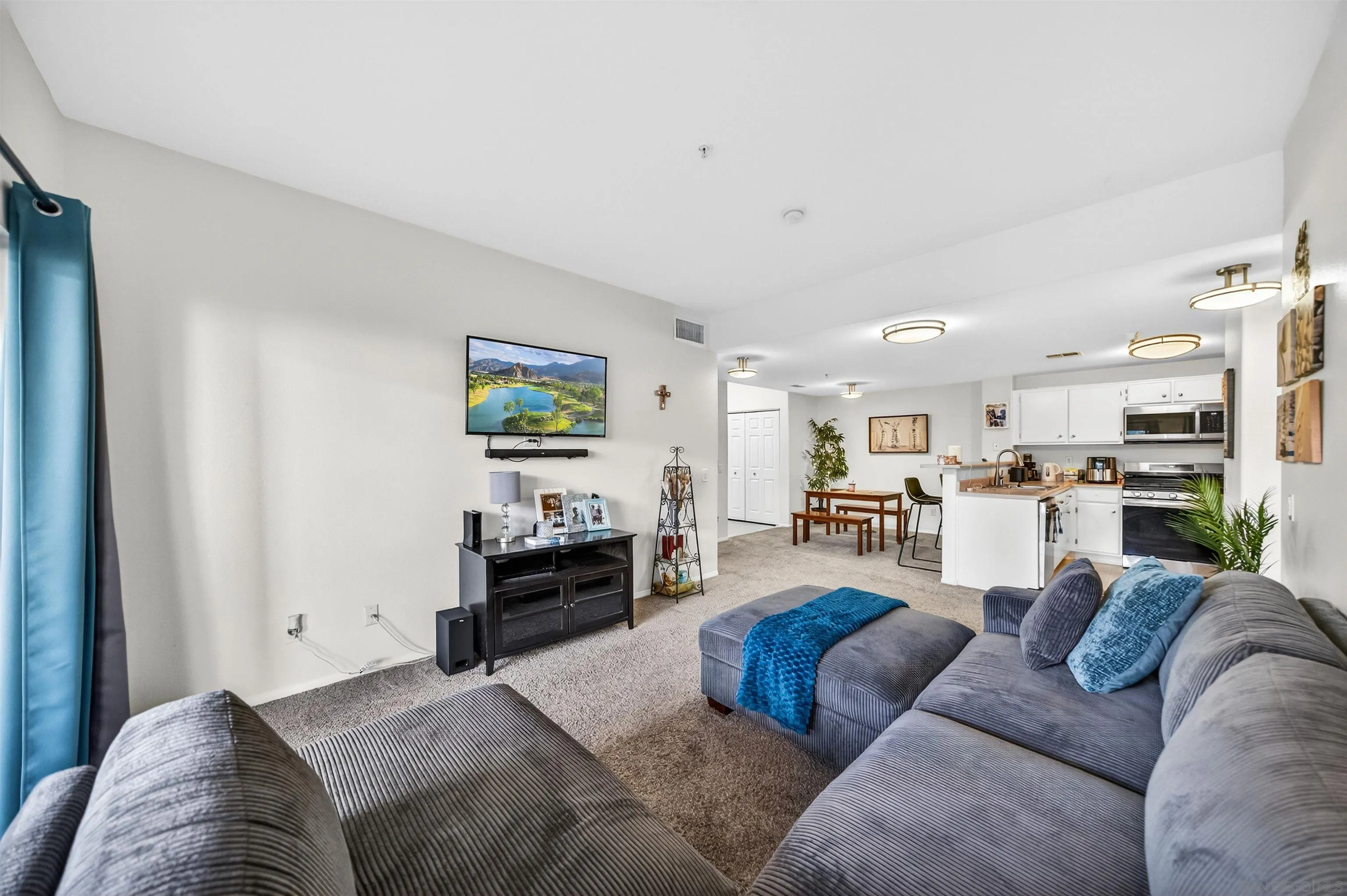 44706 Adam Lane Temecula, CA 92592 - Photo 18 of 36 a living room with furniture kitchen view and a couch