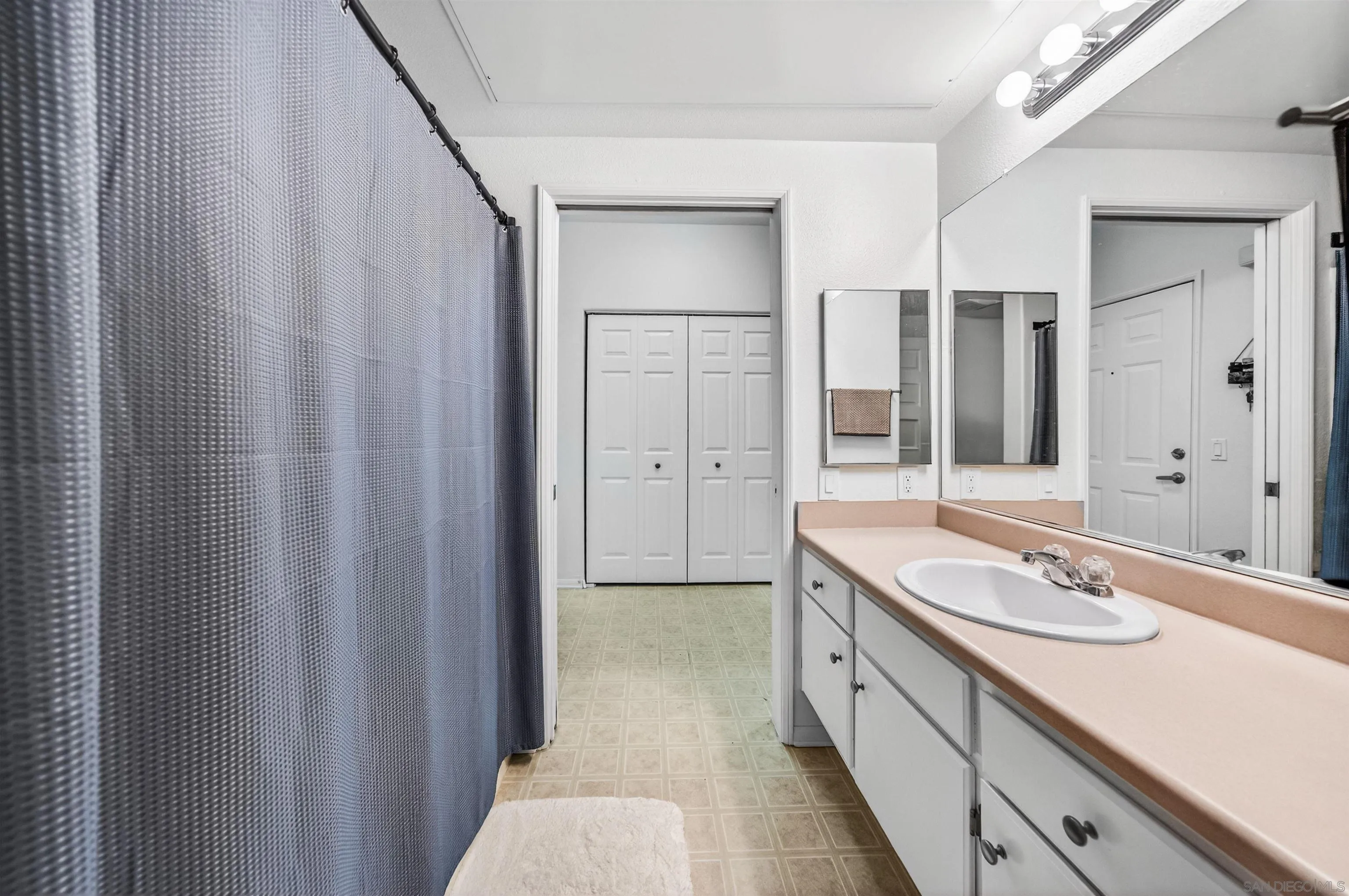 44706 Adam Lane Temecula, CA 92592 - Photo 29 of 36 a spacious bathroom with a double vanity sink and a mirror