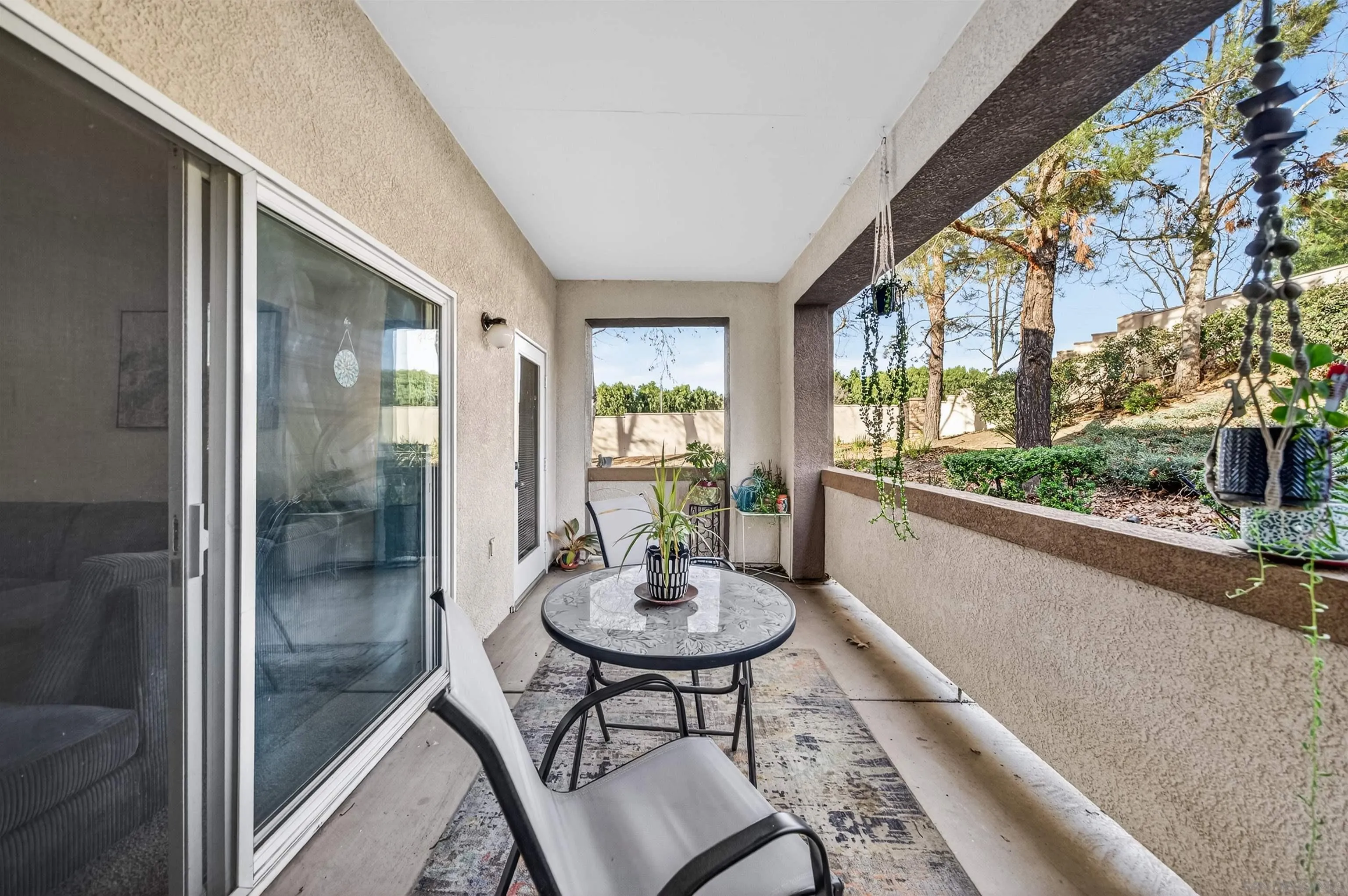44706 Adam Lane Temecula, CA 92592 - Photo 30 of 36 a view of a living room and a floor to ceiling window