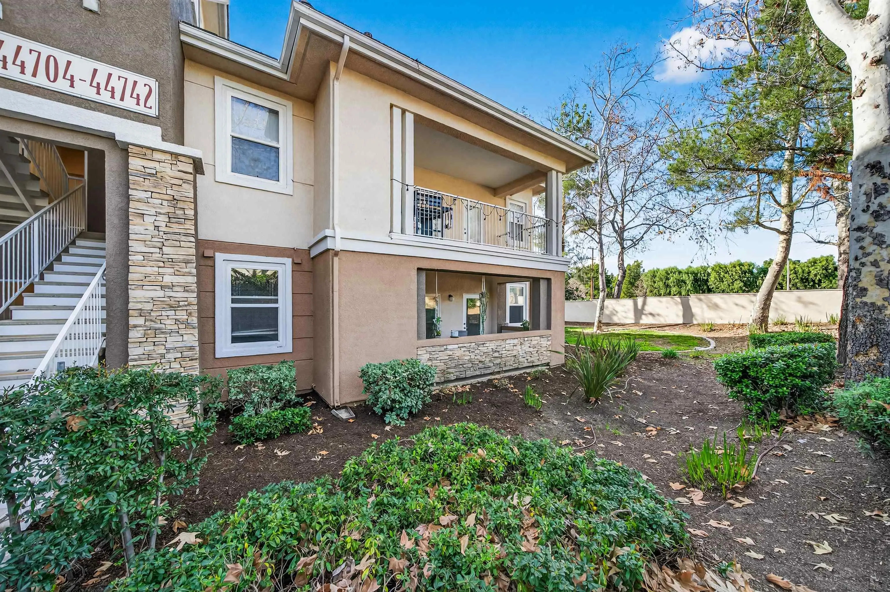 44706 Adam Lane Temecula, CA 92592 - Photo 3 of 36 a front view of a house with a garden