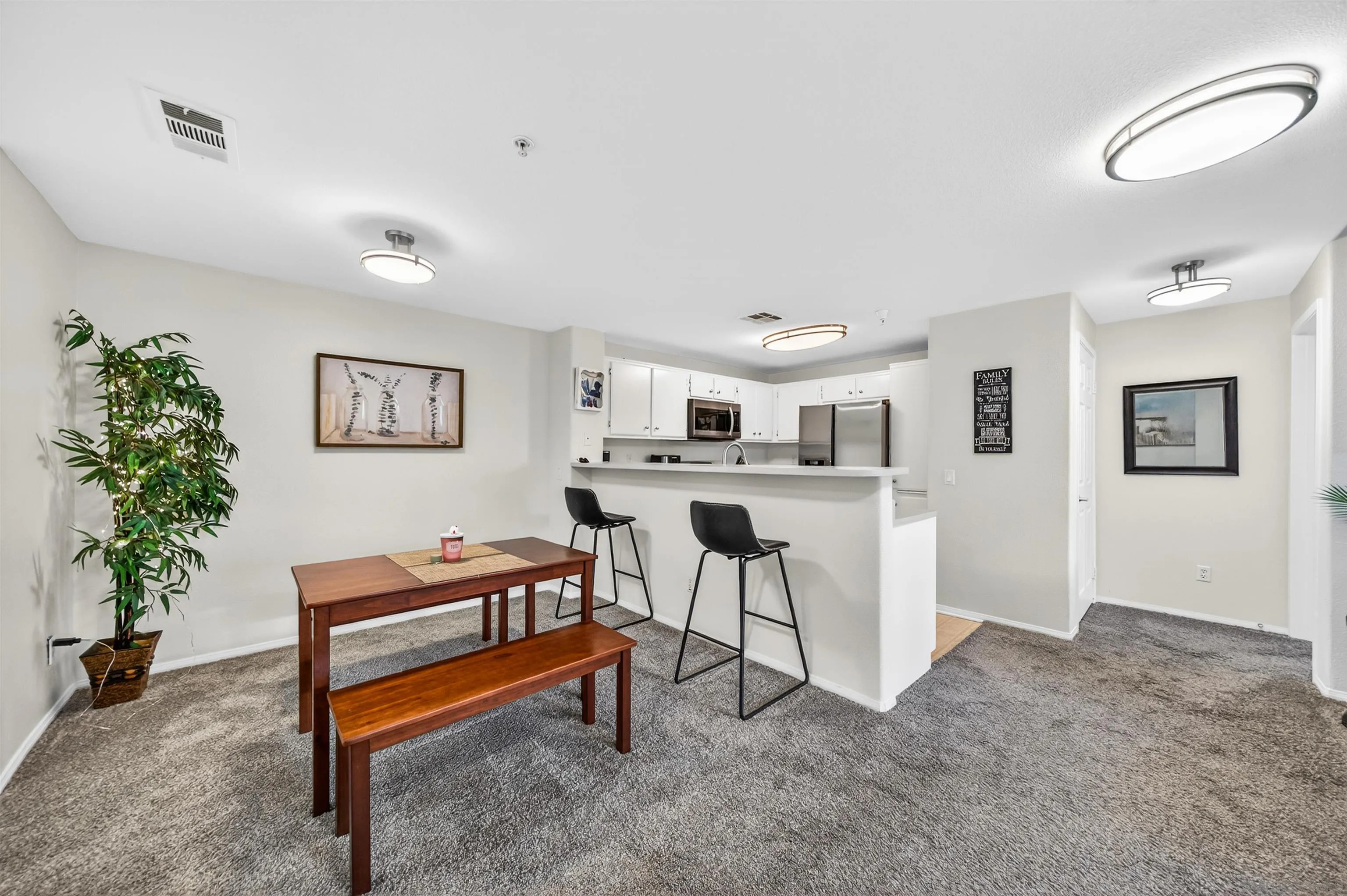 44706 Adam Lane Temecula, CA 92592 - Photo 9 of 36 a living room with furniture and a potted plant