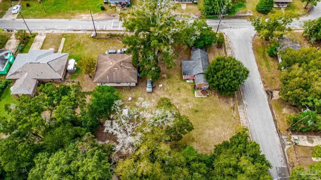 an aerial view of residential house with swimming pool