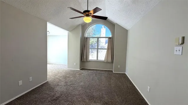 an empty room that has a window in it