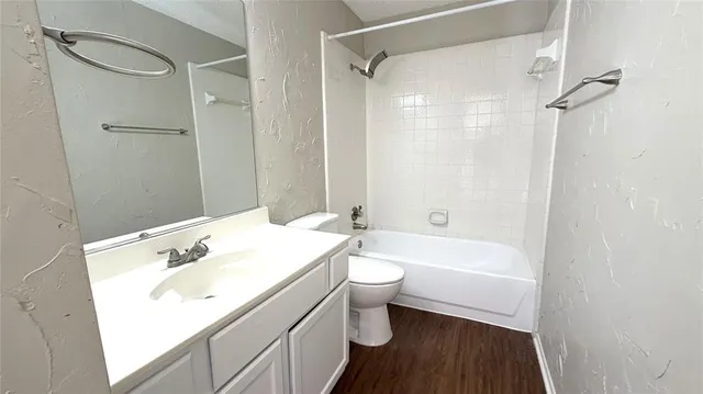 a bathroom with a sink a toilet and a bathtub