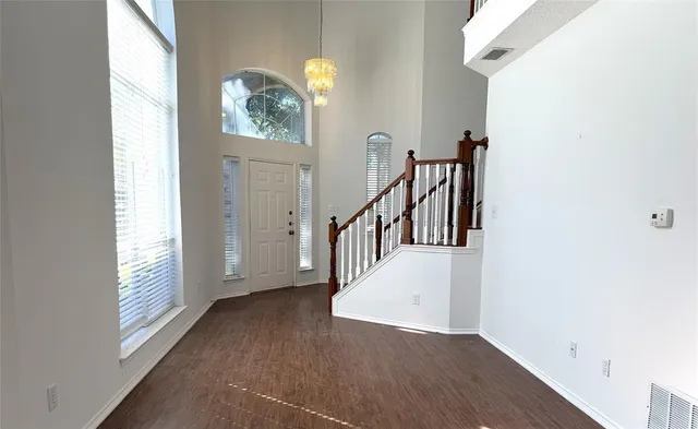 a view of entryway with wooden floor