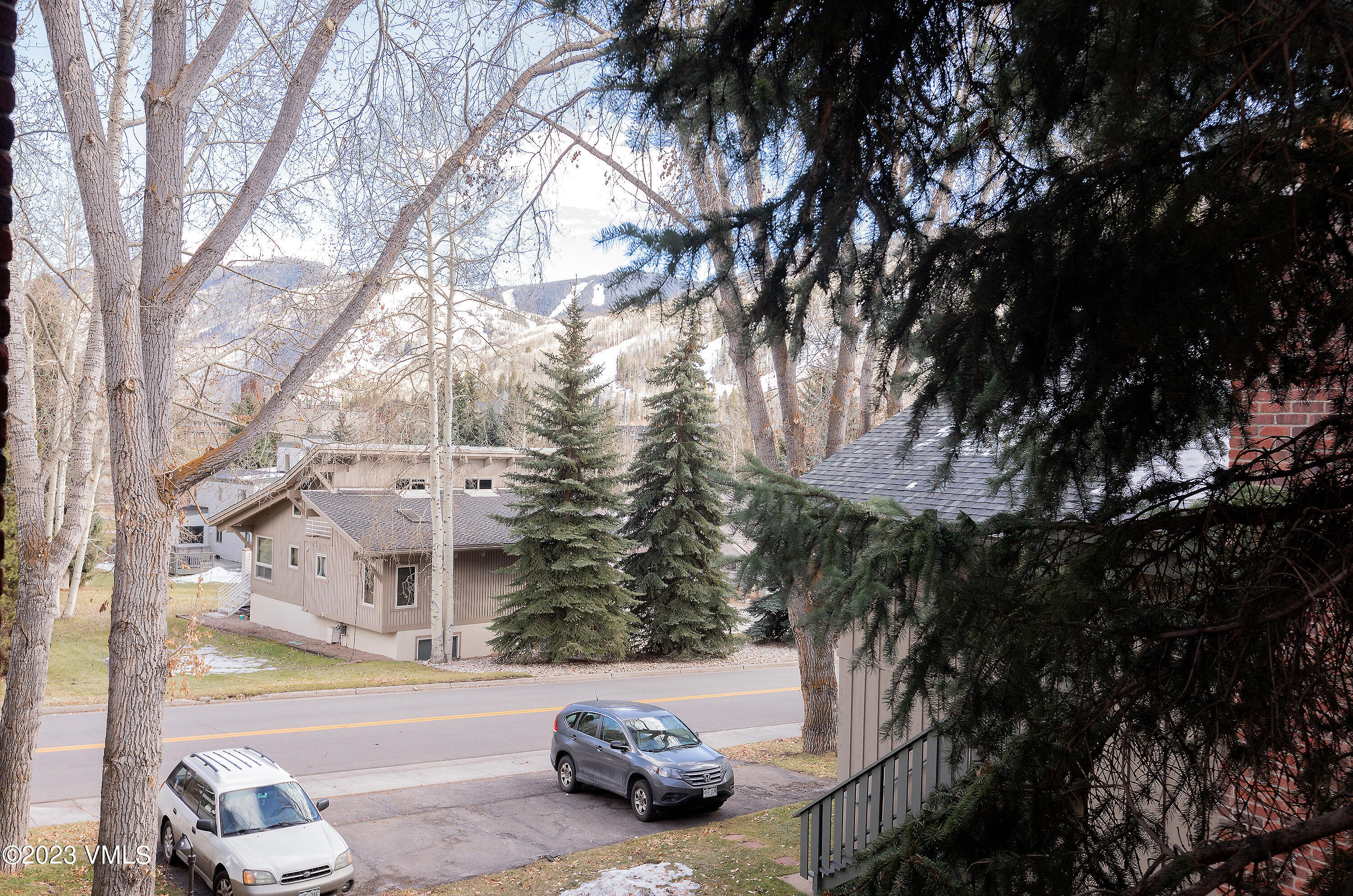 921 Red Sandstone Road, Unit D5 Vail, CO 81657 - Photo 14 of 16 a view of a city street with a car parked