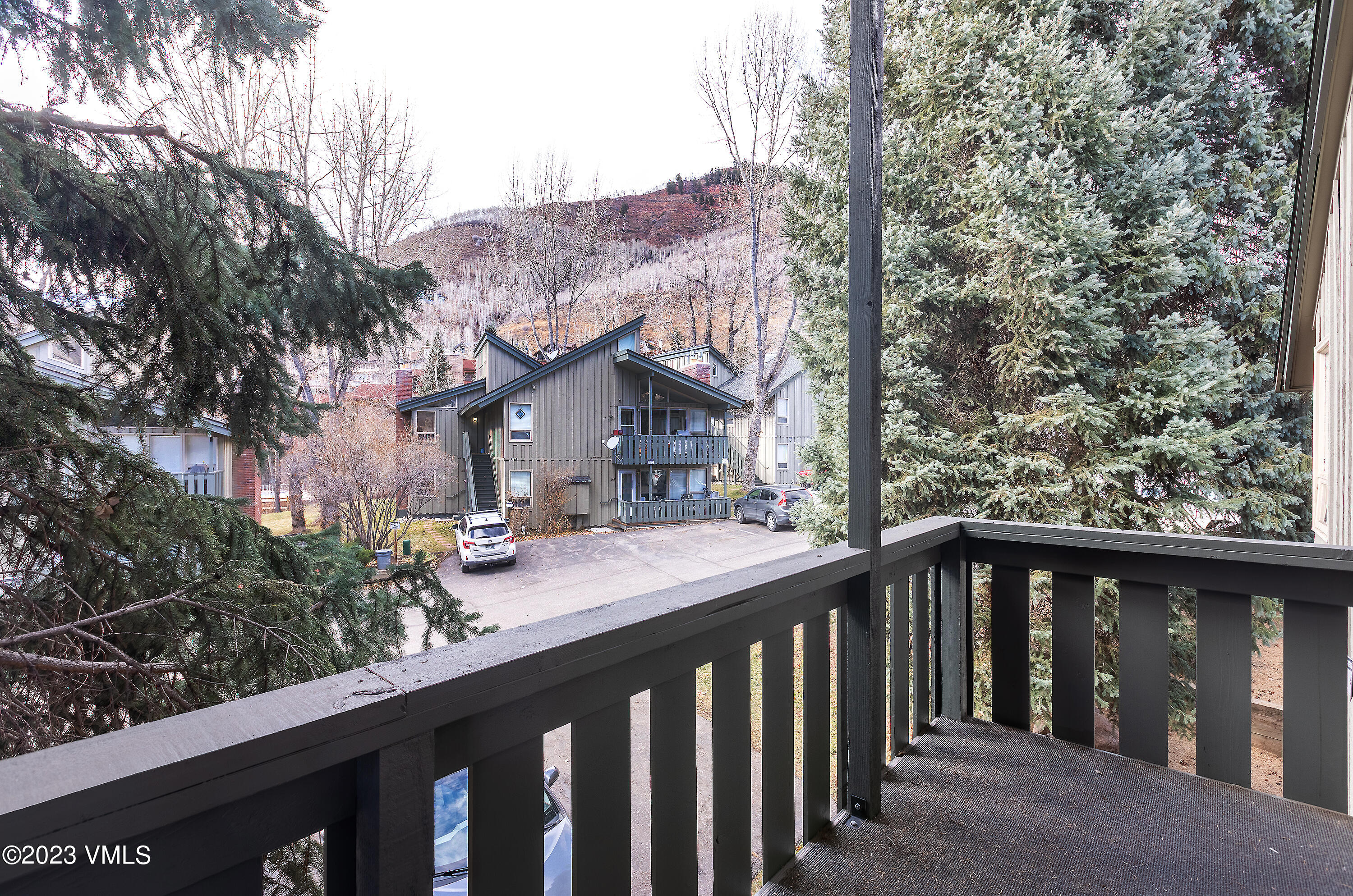 921 Red Sandstone Road, Unit D5 Vail, CO 81657 - Photo 4 of 16 a view of a wooden deck and a backyard