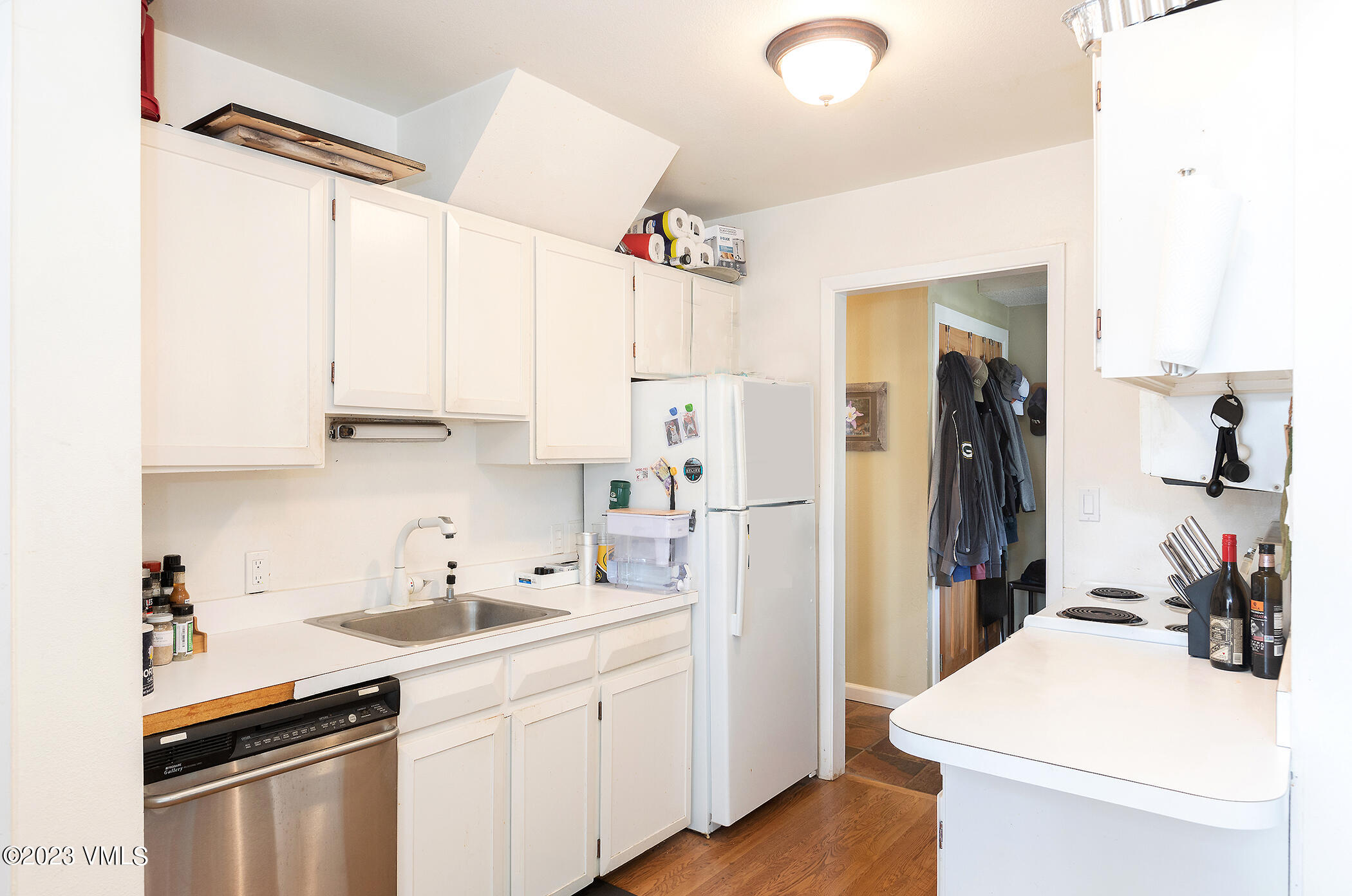 921 Red Sandstone Road, Unit D5 Vail, CO 81657 - Photo 5 of 16 a kitchen with stainless steel appliances a sink a refrigerator and a stove
