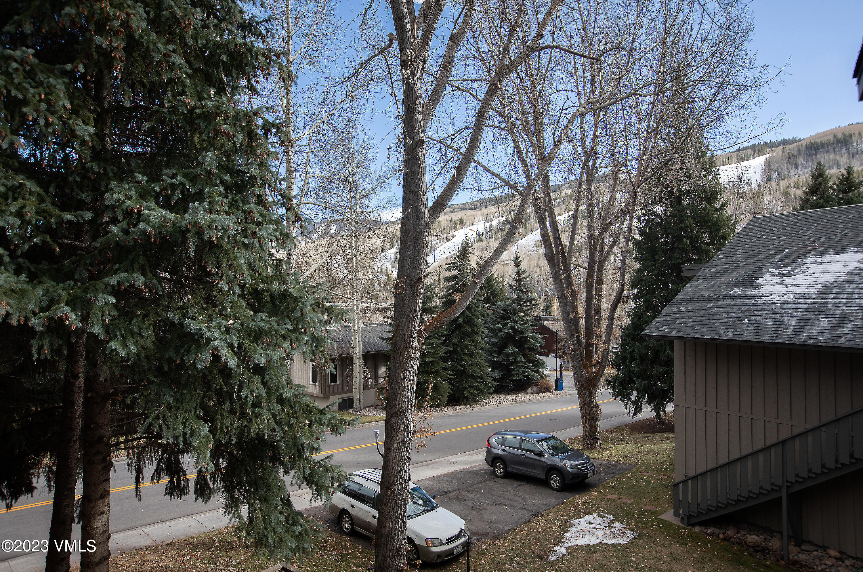 921 Red Sandstone Road, Unit D5 Vail, CO 81657 - Photo 6 of 16 a backyard of a house with car parked