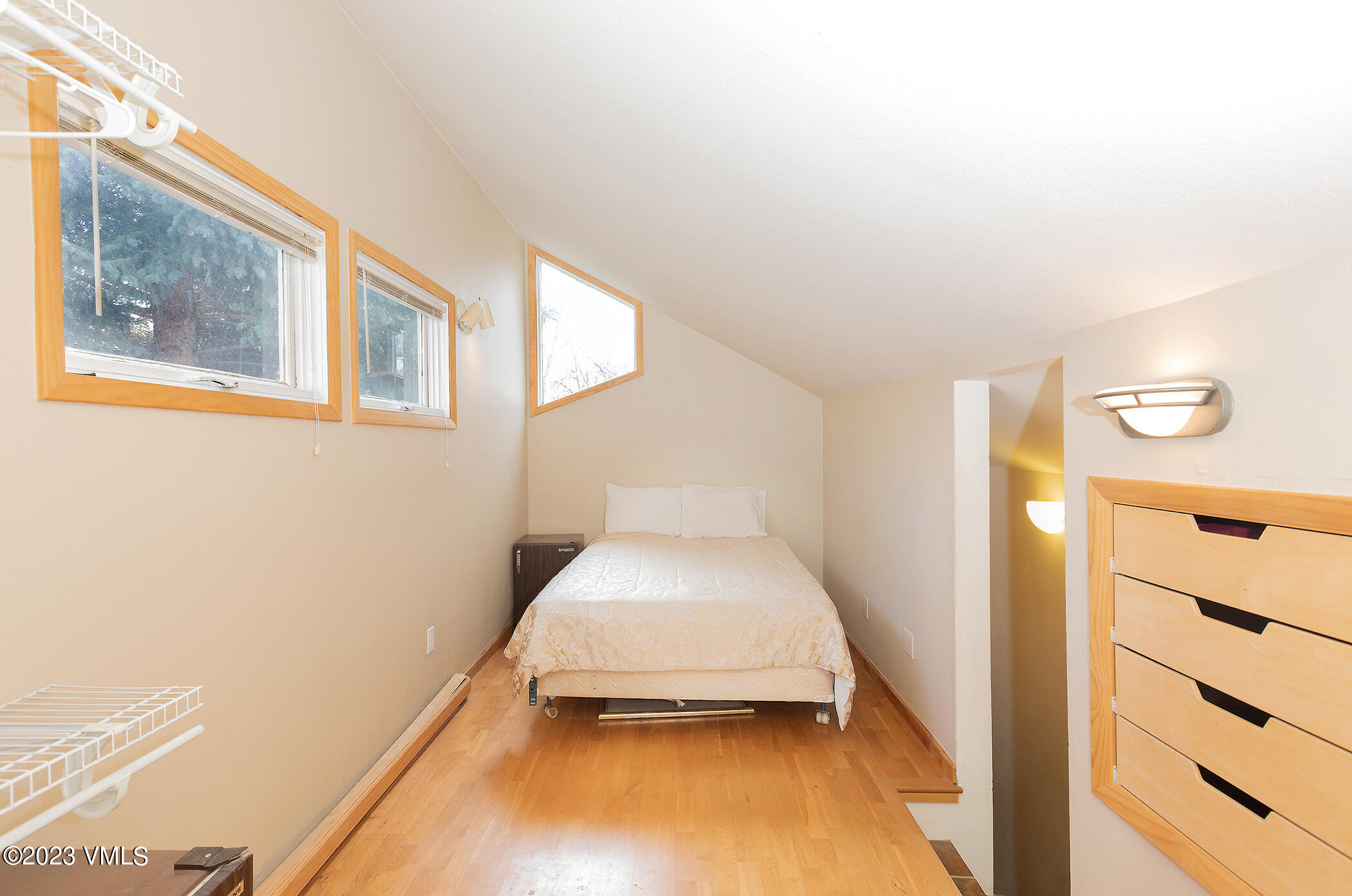 921 Red Sandstone Road, Unit D5 Vail, CO 81657 - Photo 10 of 16 a view of a room with wooden floor and windows
