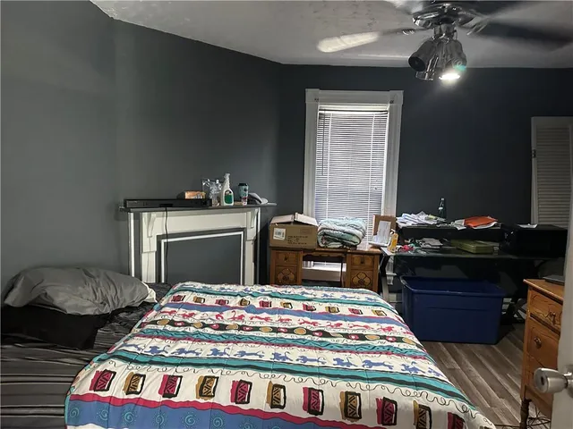 a bedroom with a bed and a dresser in it