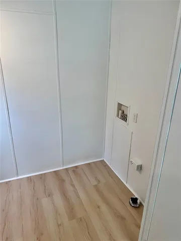 an empty room with entrance and door