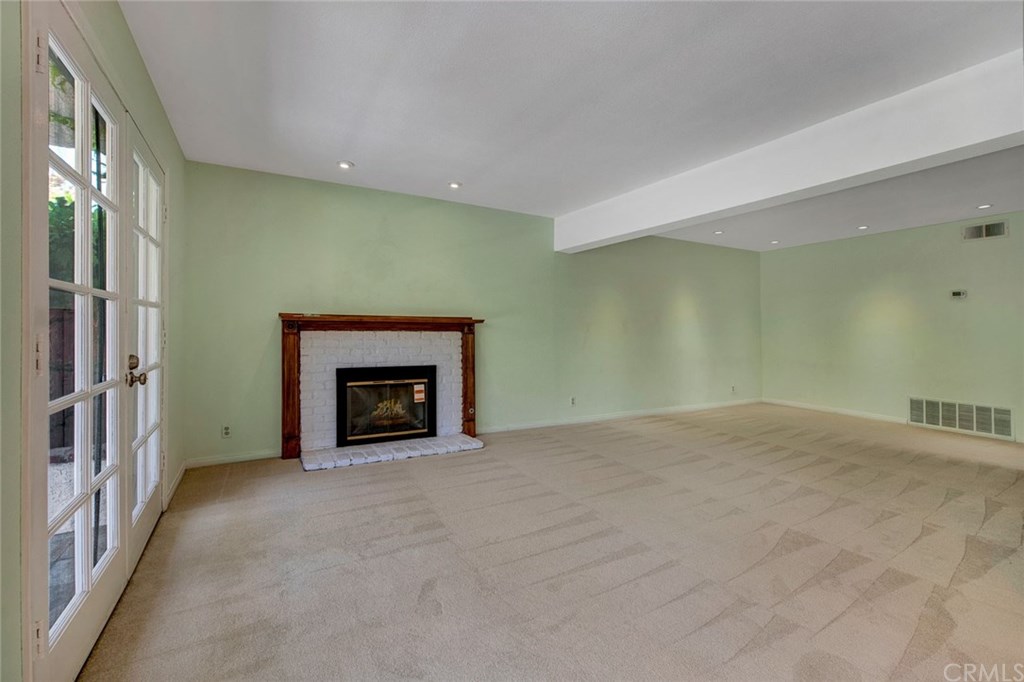 8 Bull Run Irvine, CA 92620 - Photo 23 of 52 Gas fireplace in family room