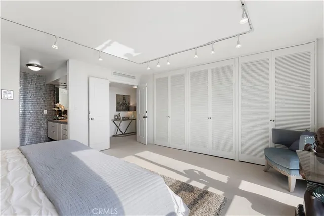 a bedroom with a bed and furniture