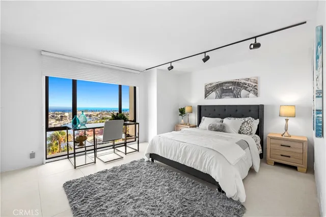 a bedroom with a bed and a table in it