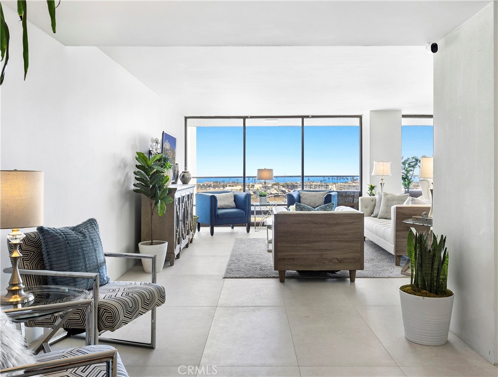 601 Lido Park Drive, Unit 6F Newport Beach, CA 92663 - Photo 2 of 28 a living room with furniture and a potted plant
