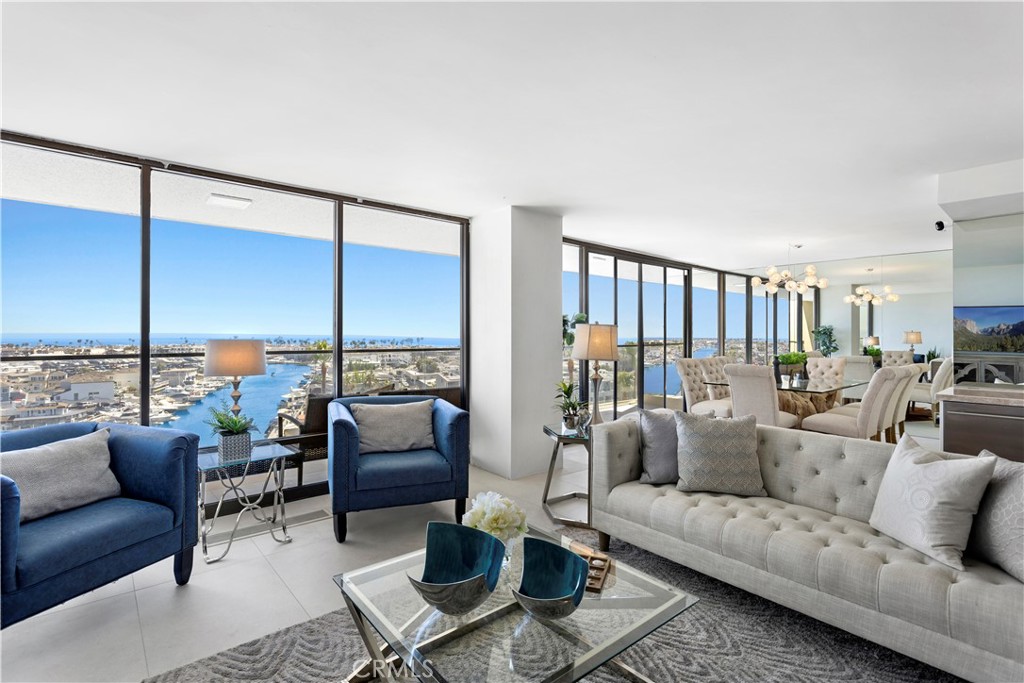 601 Lido Park Drive, Unit 6F Newport Beach, CA 92663 - Photo 3 of 28 a living room with furniture and a large window