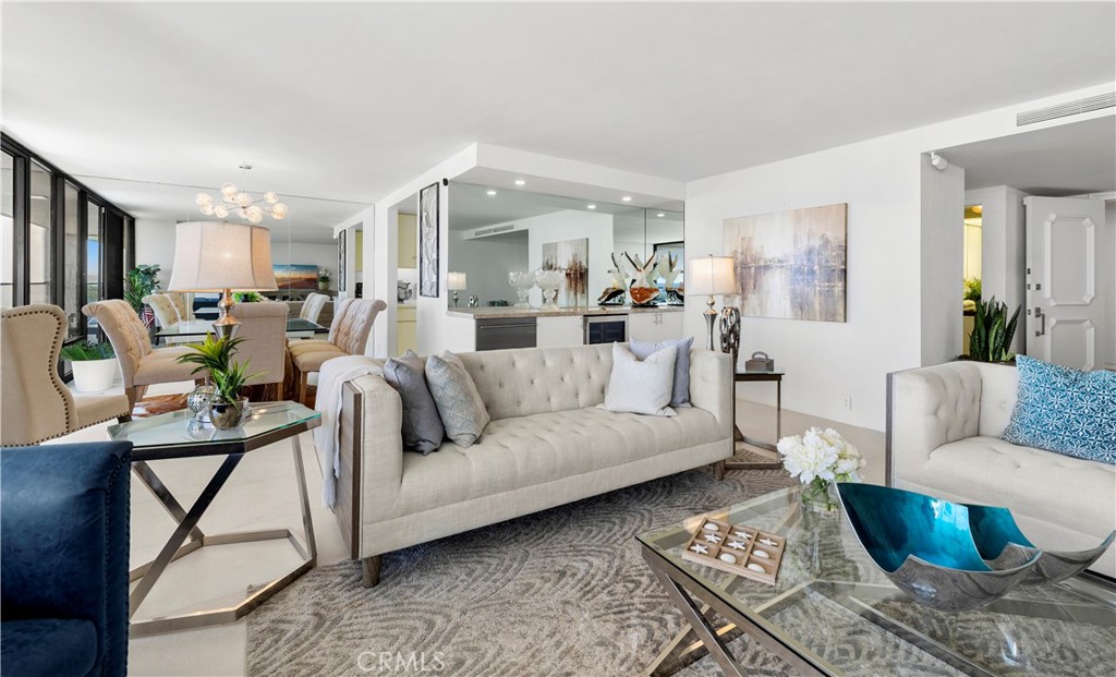 601 Lido Park Drive, Unit 6F Newport Beach, CA 92663 - Photo 4 of 28 a living room with furniture and a table