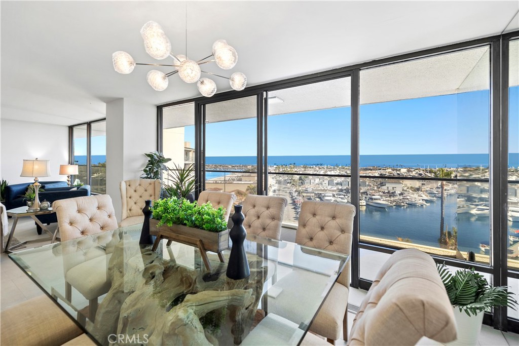 601 Lido Park Drive, Unit 6F Newport Beach, CA 92663 - Photo 8 of 28 a living room with furniture and a large window