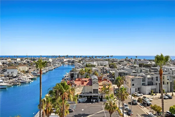 an aerial view of a city with ocean view