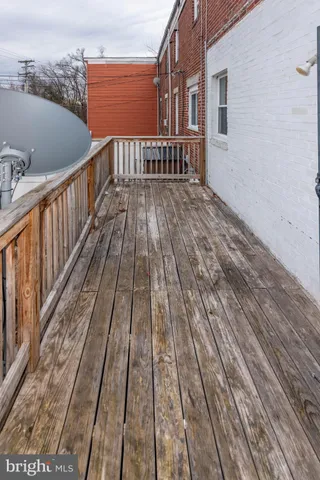 a view of wooden balcony with wooden floor