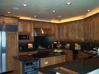 160 Cresta (alpine Club, Unit R403 Edwards, CO 81632 - Photo 6 of 8 a kitchen with kitchen island granite countertop a stove and a refrigerator