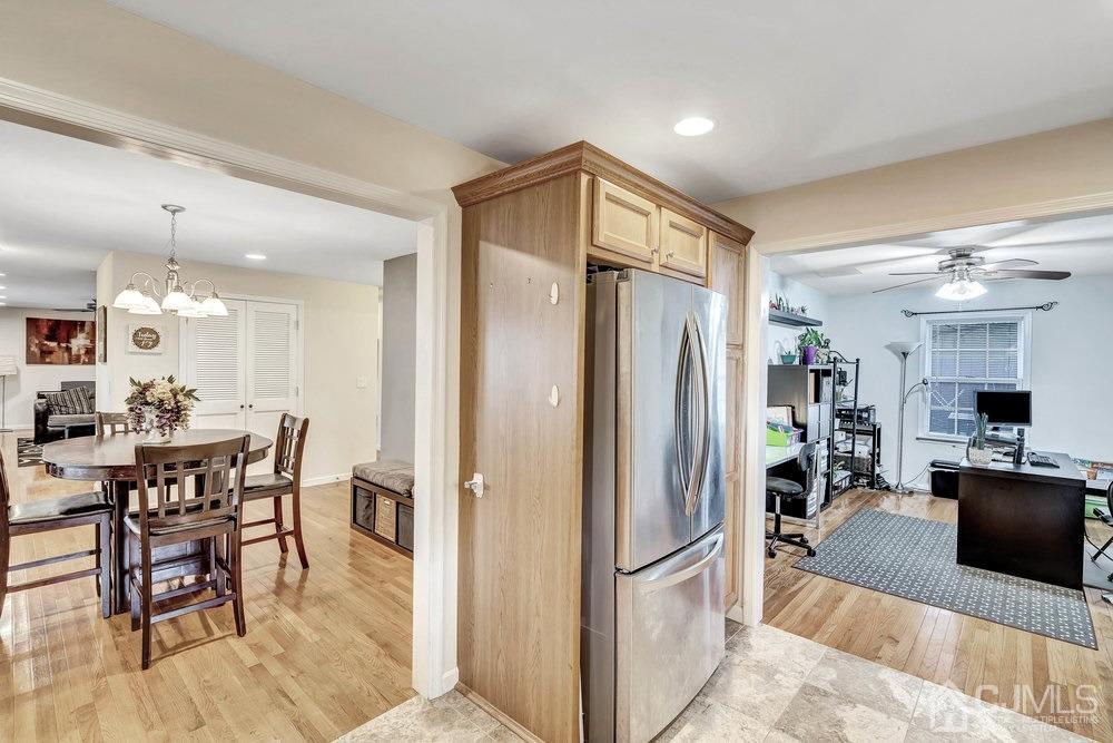 32 Comstock Road Edison, NJ 08817 - Photo 8 of 23 a kitchen with stainless steel appliances granite countertop a refrigerator and a dining table
