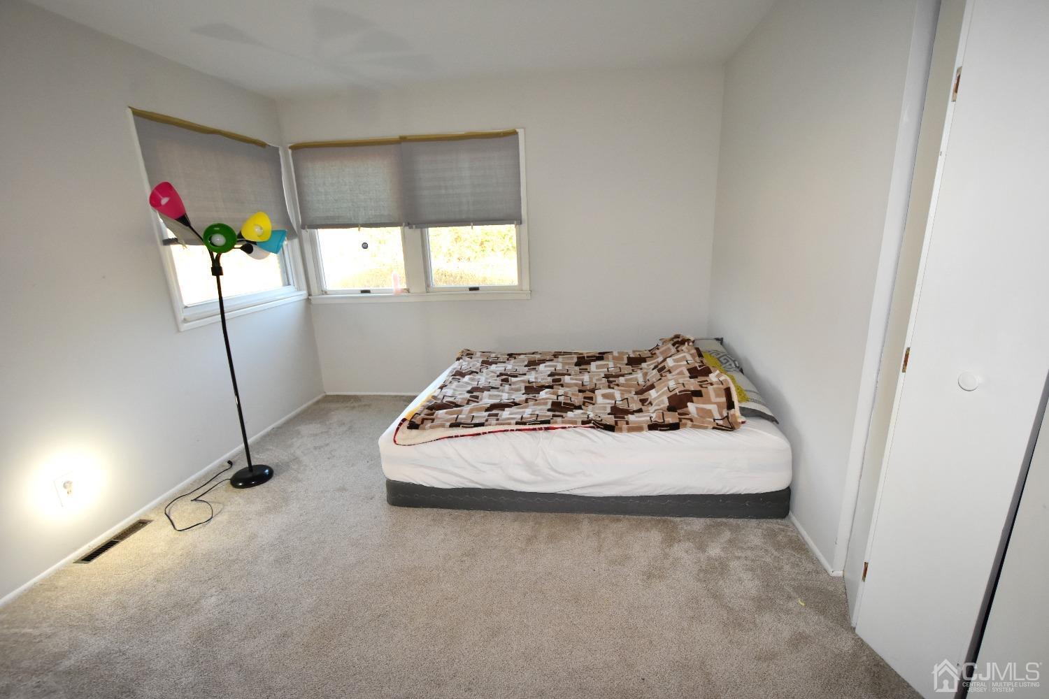 7 Calvin Road Kendall Park, NJ 08824 - Photo 11 of 28 a view of a garage and a couch