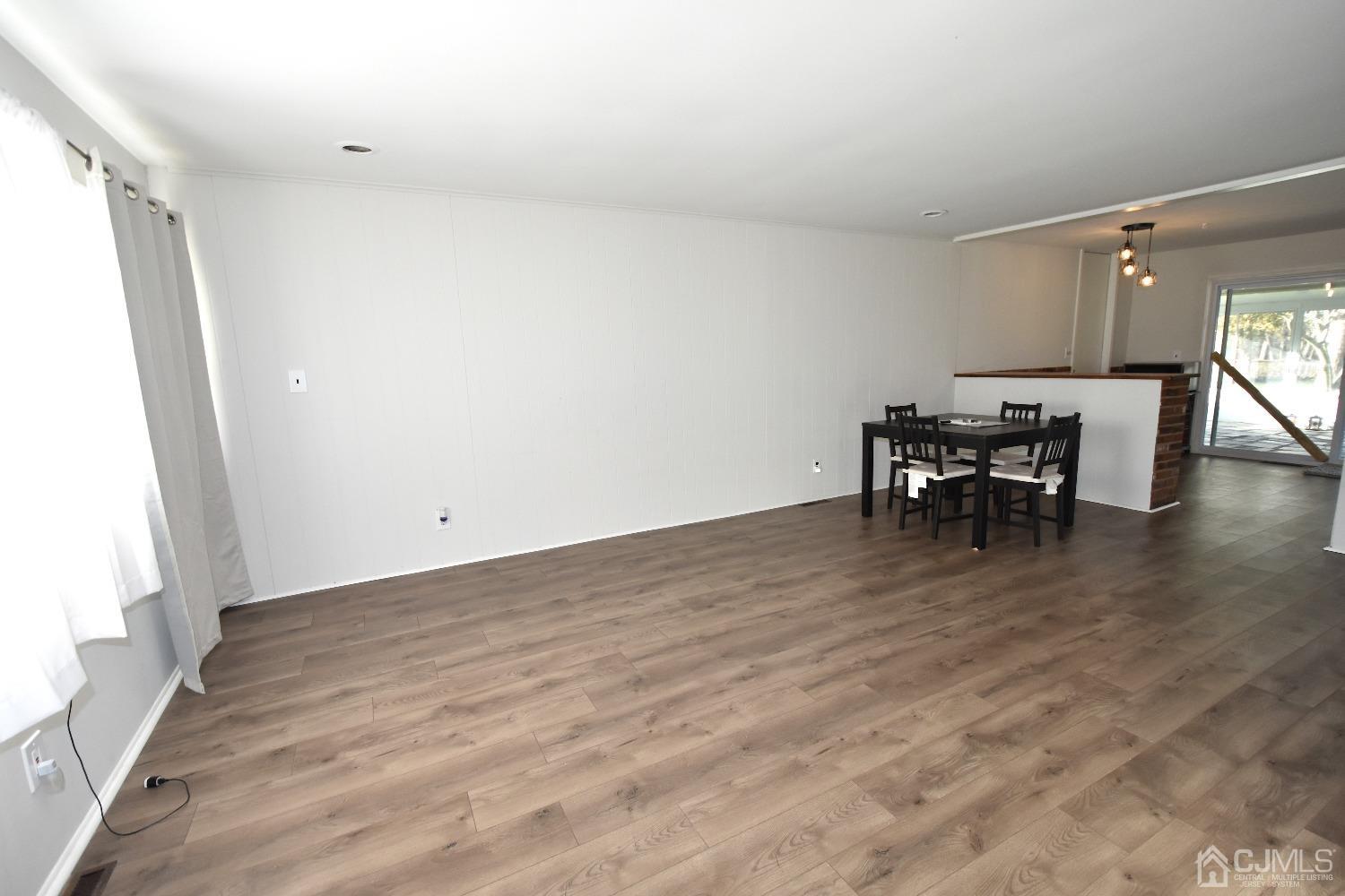 7 Calvin Road Kendall Park, NJ 08824 - Photo 6 of 28 a view of a room with wooden floor table and chairs